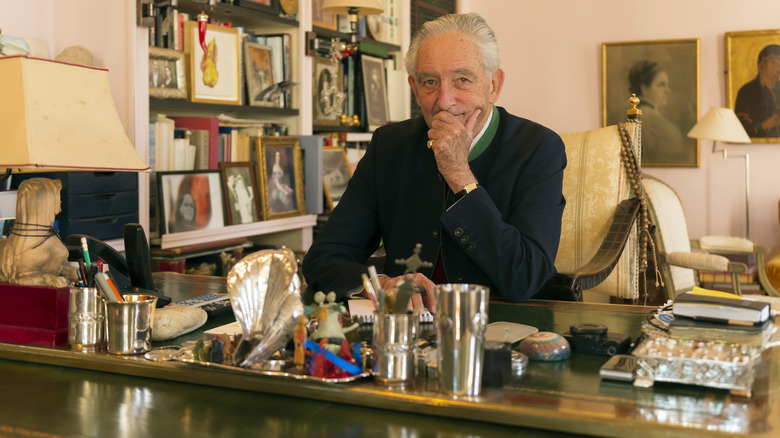 Prince Michael sitting at a desk