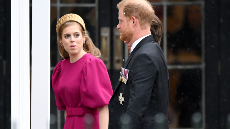 Princess Beatrice speaking to Prince Harry