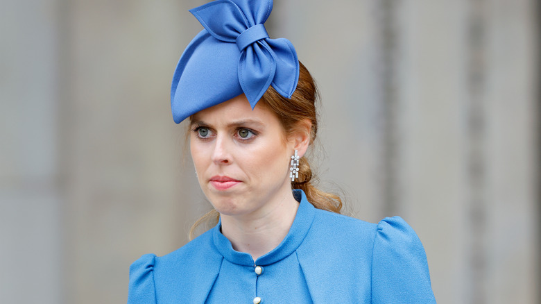 Princess Beatrice looking on