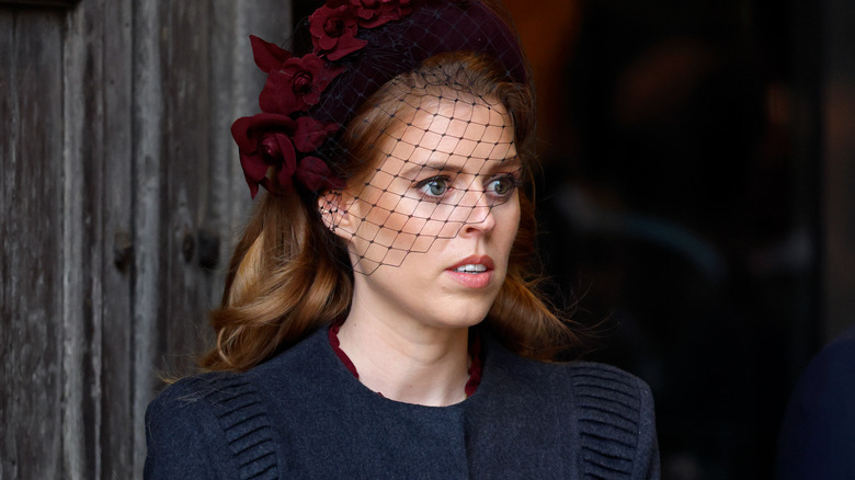 Princess Beatrice looking on