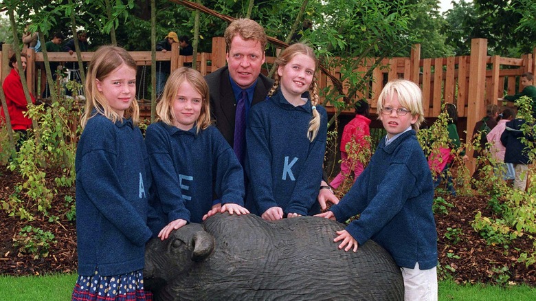 Charles Spencer posing with his four eldest children