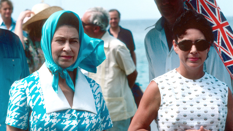 Princess Margaret standing with Queen Elizabeth