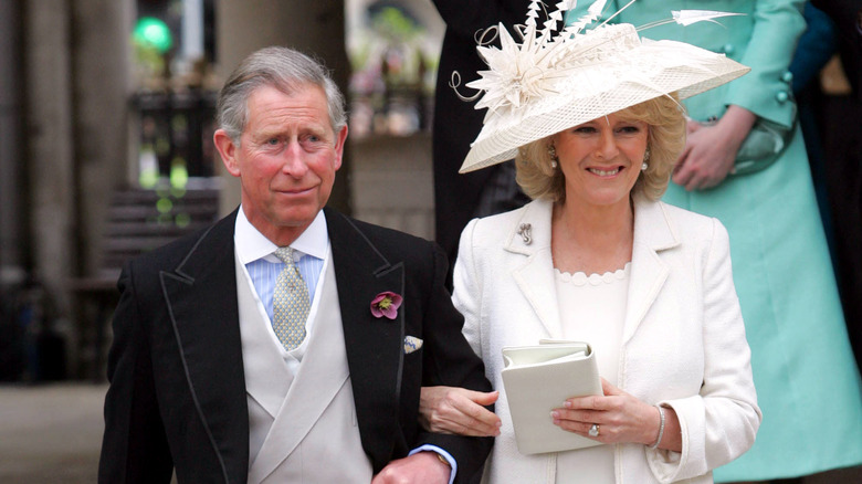 Camilla on the arm of Prince Charles