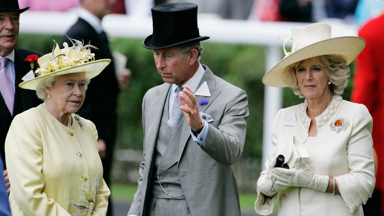 Queen Elizabeth next to Charles and Camilla