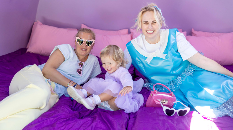 Ramona Agruma, Rebel Wilson, and their daughter Royce at Polly Pocket Air BnB in Littleton, Massachusetts