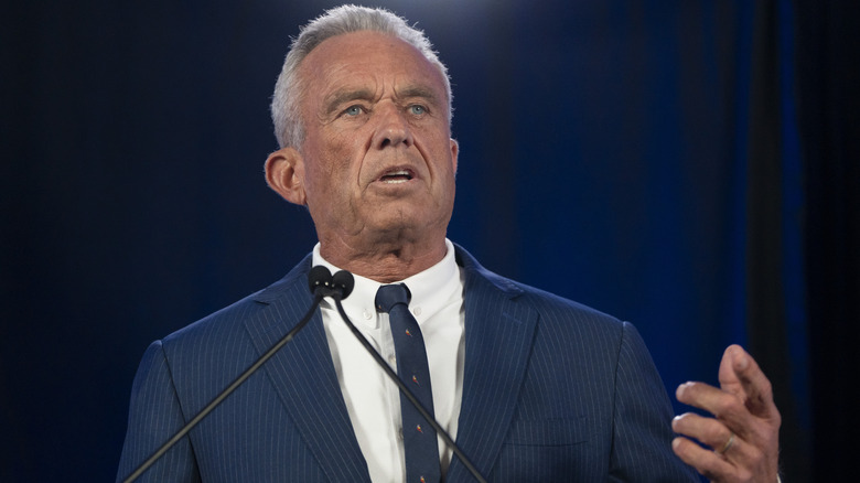 RFK Jr. talking in microphones at a rally