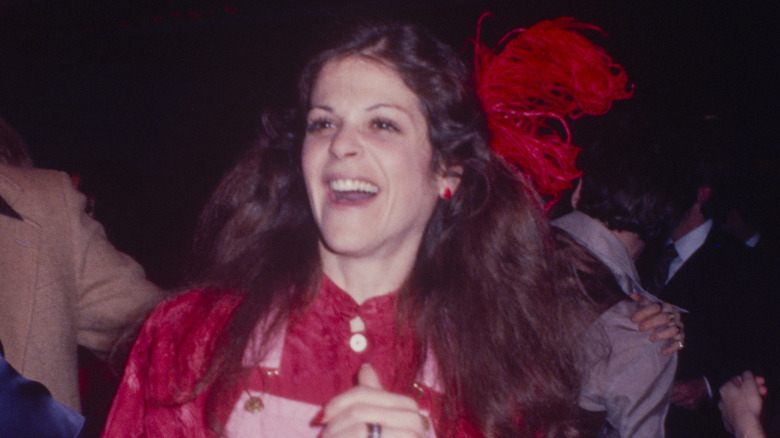 Gilda Radner laughing and dancing in Studio 54