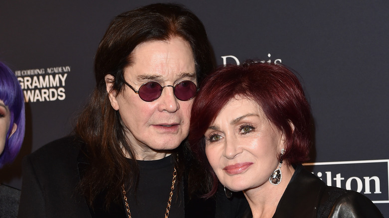 Sharon Osbourne and Ozzy Osbourne posing for photos