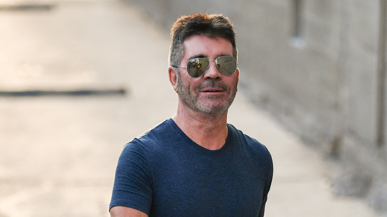 Simon Cowell wearing aviator sunglasses