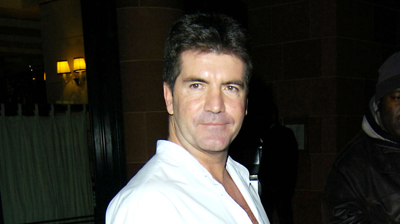 Simon Cowell in white shirt outside restaurant