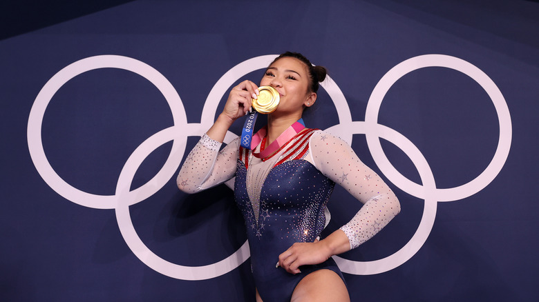 Sunisa Lee kissing her gold medal