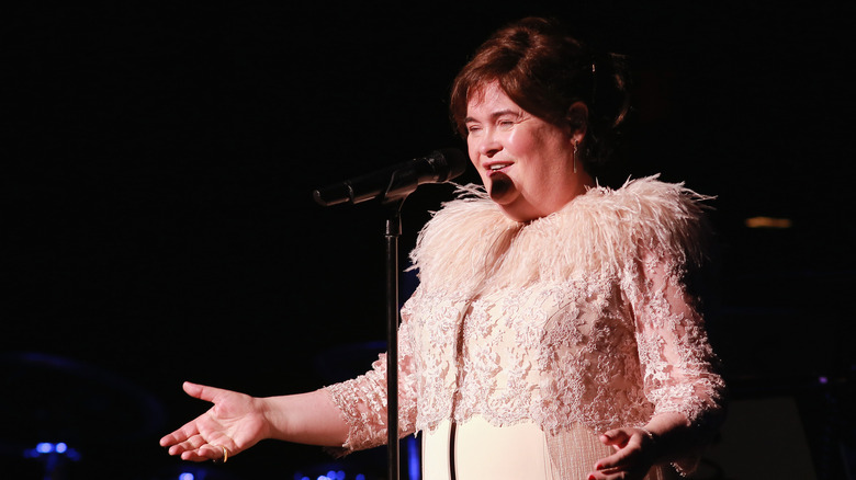 Susan Boyle singing into microphone