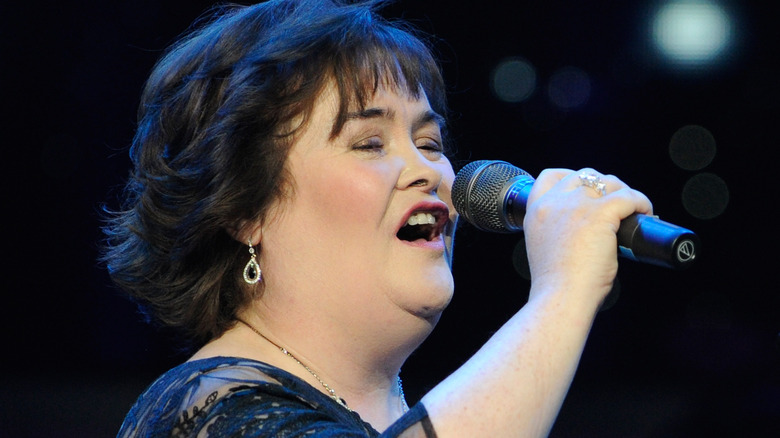 Susan Boyle singing into microphone