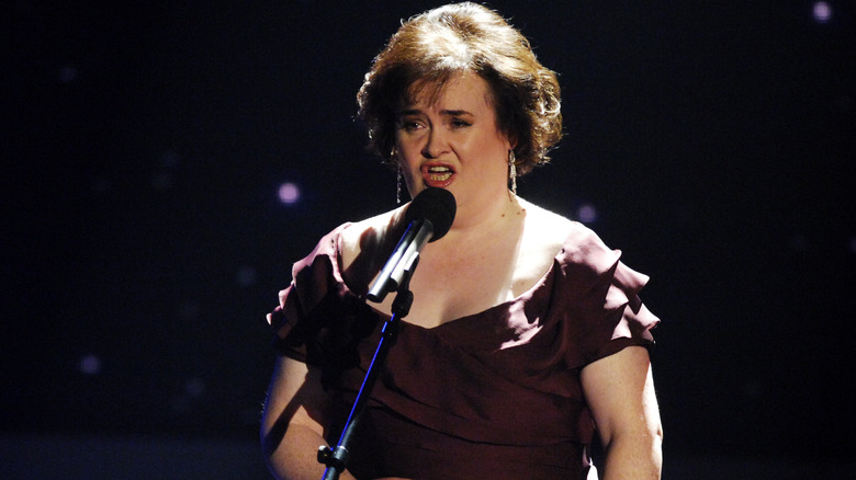 Susan Boyle singing into microphone