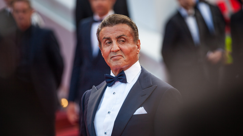 Sylvester Stallone smiling in tuxedo