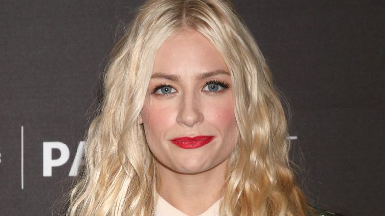 Beth Behrs posing at an event