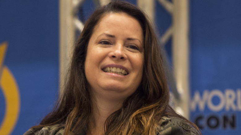 Holly Marie Combs smiling onstage