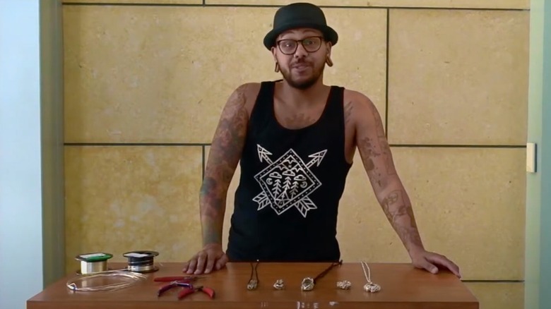 Craig Lamar Traylor showing off his handmade jewelry in 2017