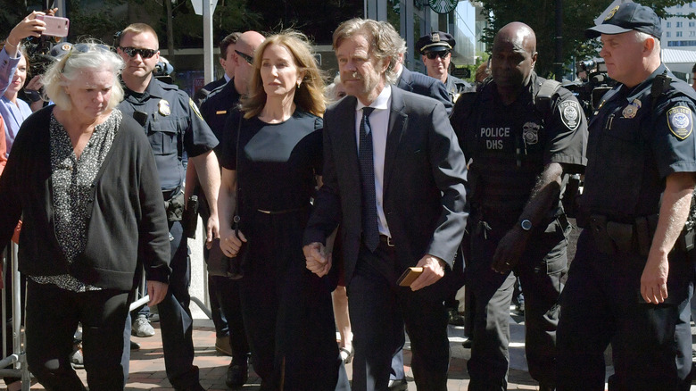 William H. Macy and Felicity Huffman at a courthouse in Boston, 2019.