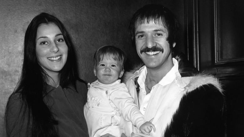 Cher and Sonny Bono holding baby Chaz Bono