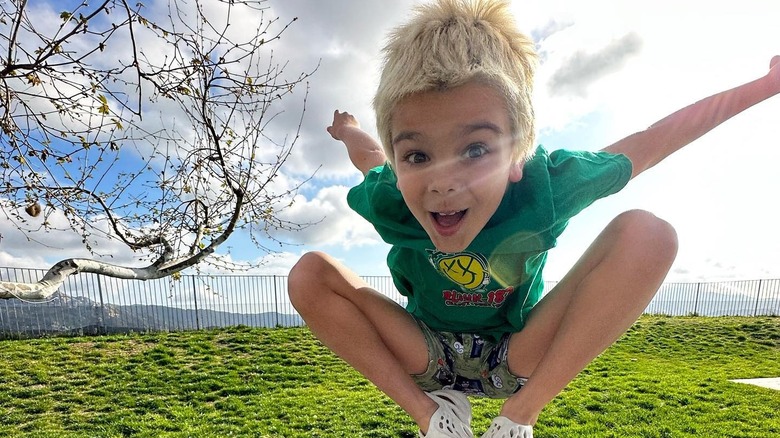 Reign Disick jumping on a trampoline