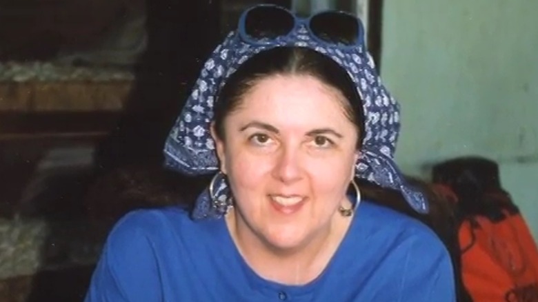 Ann Dunham smiling slightly and looking introspective