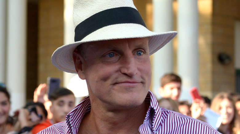 Woody Harrelson poses for photos with fans