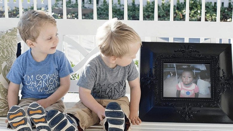 Nathan and Ben Marrs with photo of Sylvie Marrs