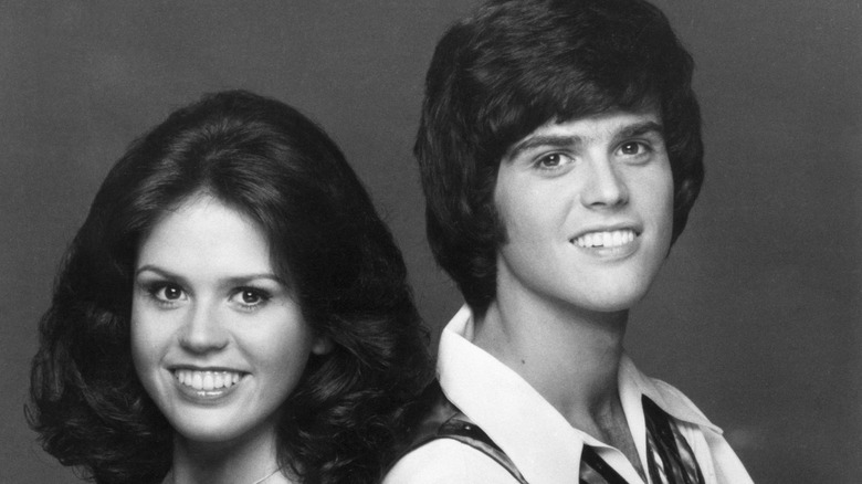 Marie and Donny Osmond, smiling