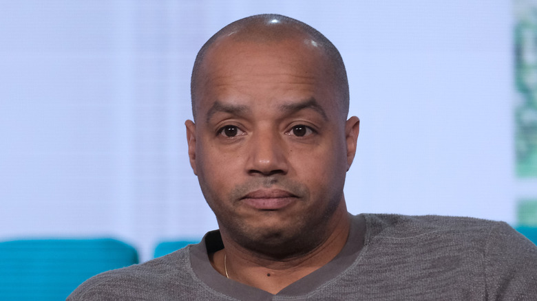 Donald Faison looking serious during an interview