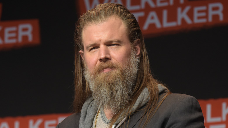 Ryan Hurst frowns slightly at a press event