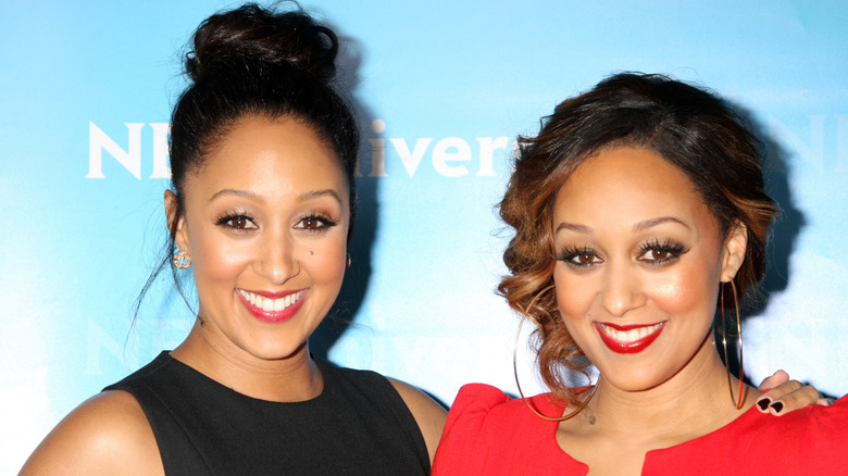 Tamera Mowry-Housley smiles with Tia Mowry