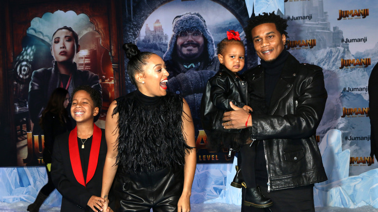 Tia Mowry and Cory Hardrict smile with their children