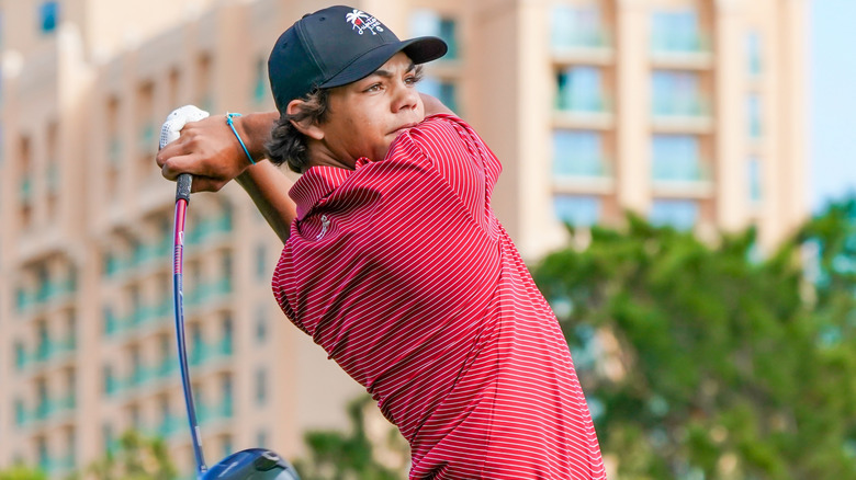 Charlie Woods swinging a golf club