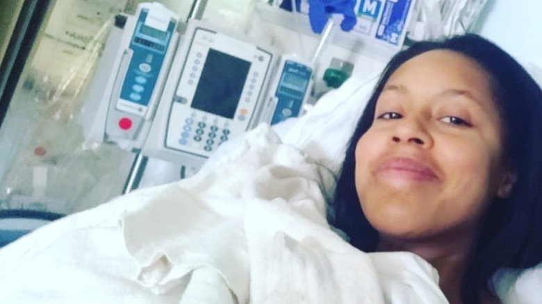 Sheinelle Jones takes a selfie in a hospital bed