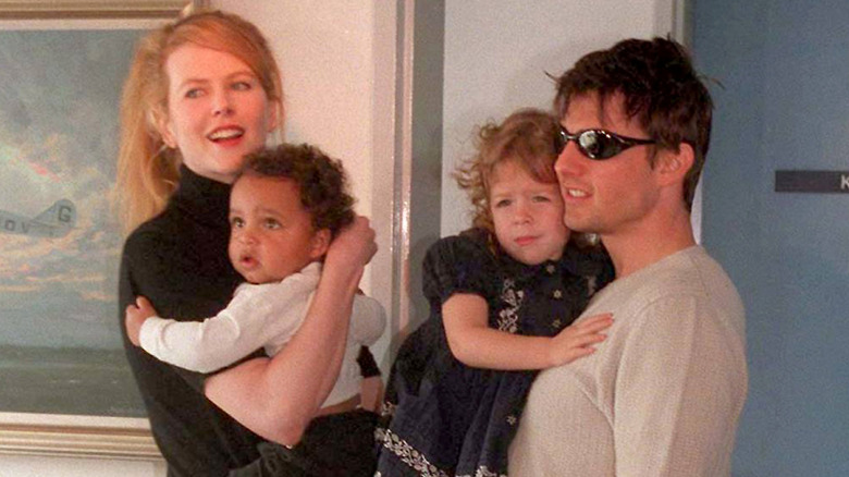 Nicole Kidman and Tom Cruise holding their kids