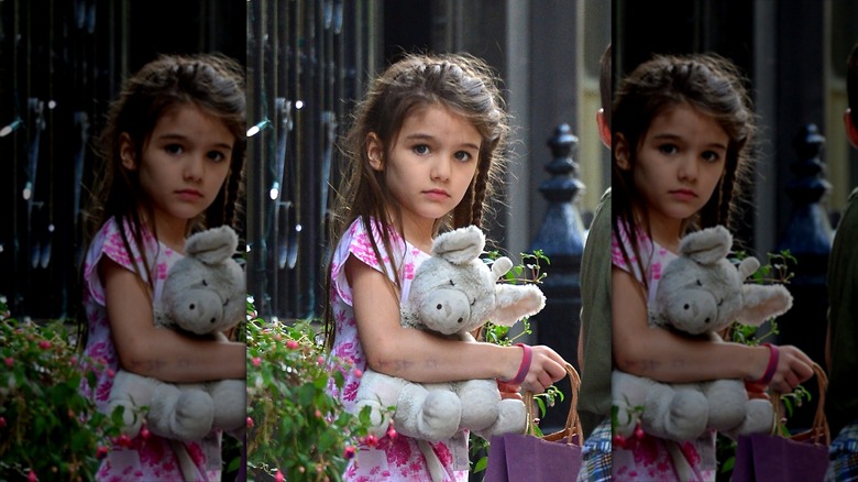 Suri Noelle holding a plushie