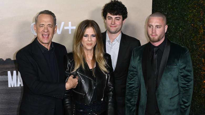 Chet Hanks in green suit with his father, mother, and younger brother