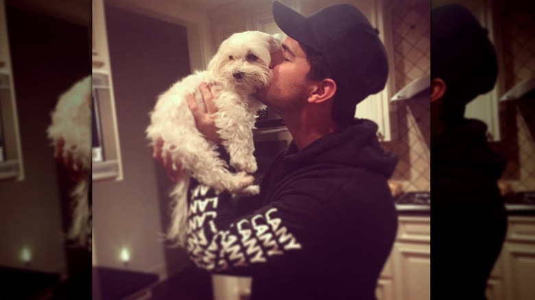 Taylor Lautner kissing his dog