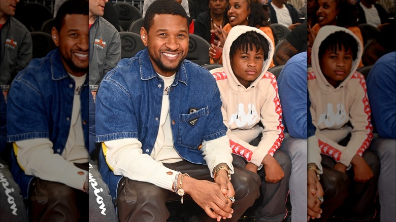 Usher sitting with his son Usher Raymond V 