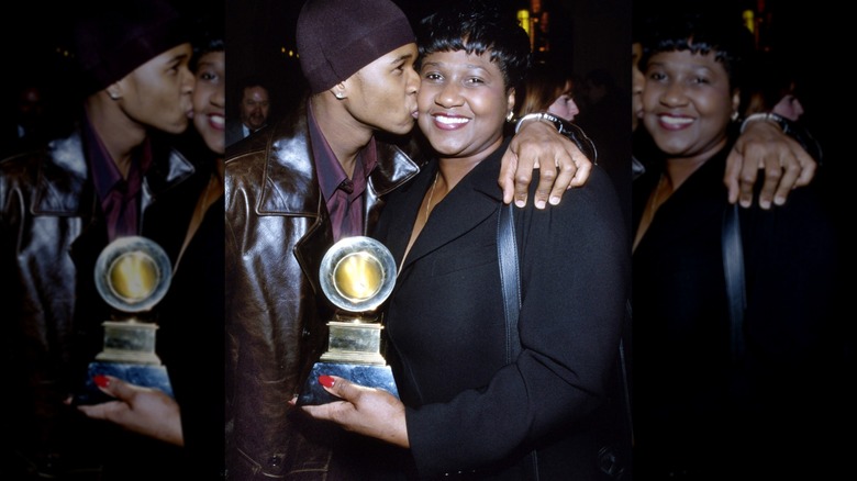 Usher kissing his mother on the cheek
