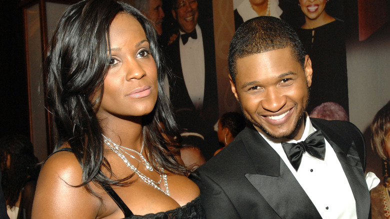 Tameka Foster and Usher arm in arm 
