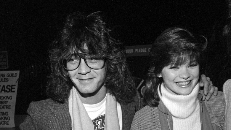 Eddie Van Halen wearing glasses while accompanying Valerie Bertinelli in the 1980s