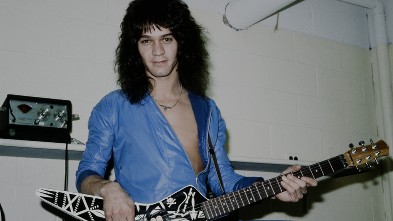 Eddie Van Halen posing with his guitar