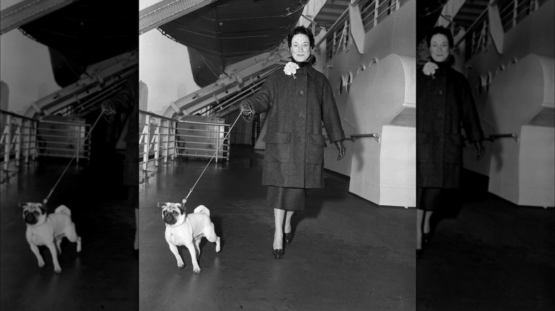 Wallis Simpson walks a dog 