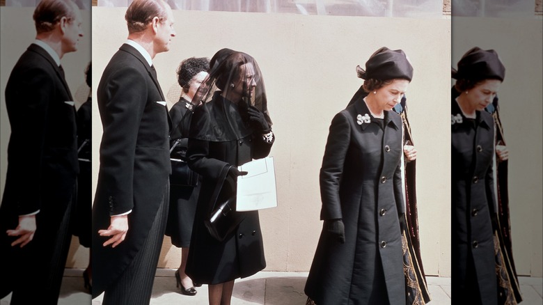 Wallis Simpson walks behind Queen Elizabeth II 
