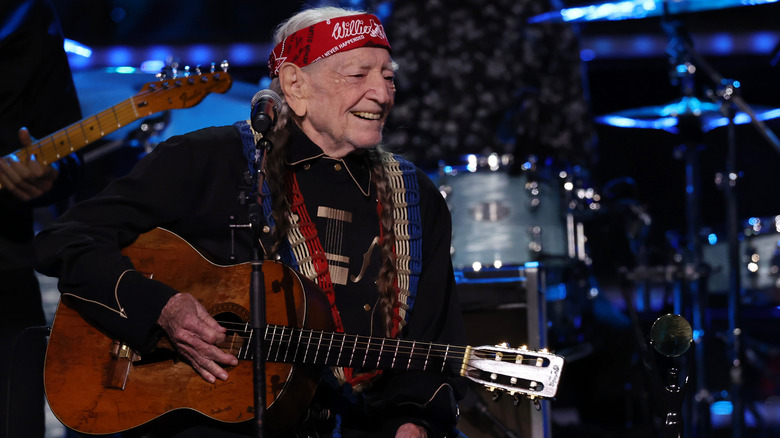 Willie Nelson with his guitar