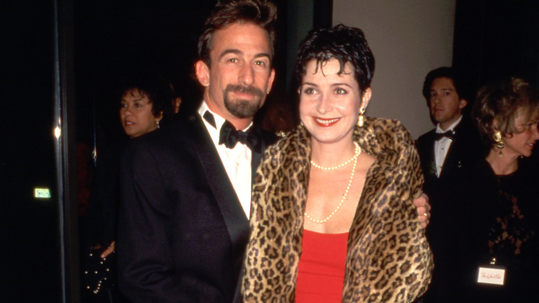 James Hayman arm around Annie Potts formal wear