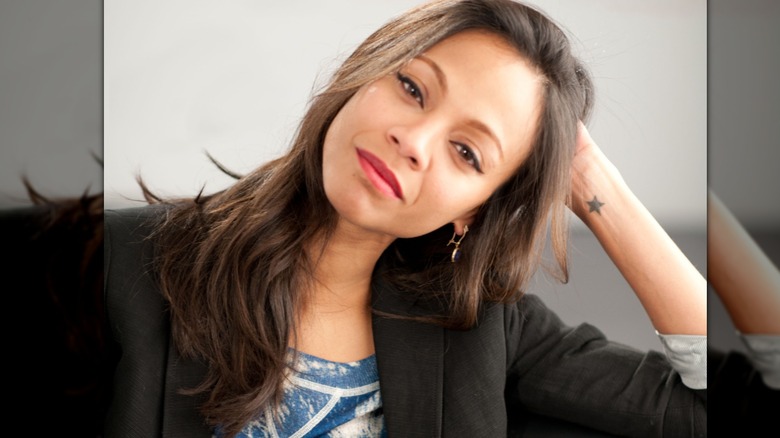 Zoe Saldana posing for The Words portraits in 2012