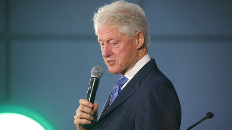 Bill Clinton speaks into mic